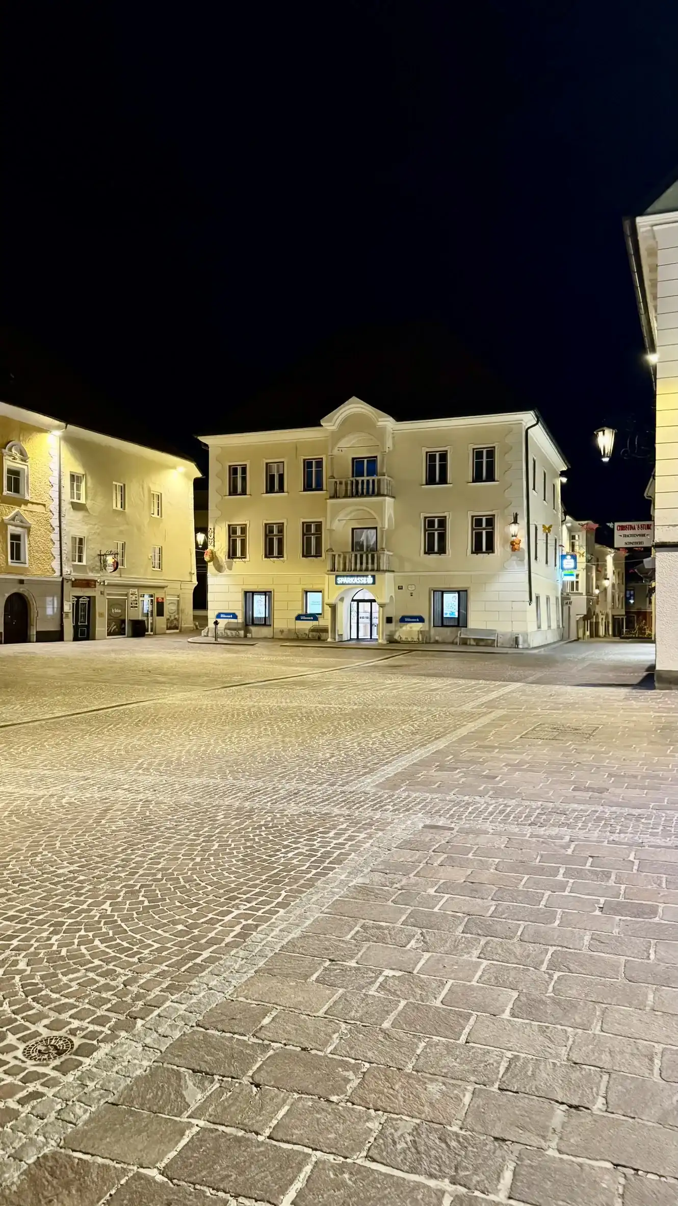 "Carinthia House" is located at the eastern end of the main square. Illuminated at night.