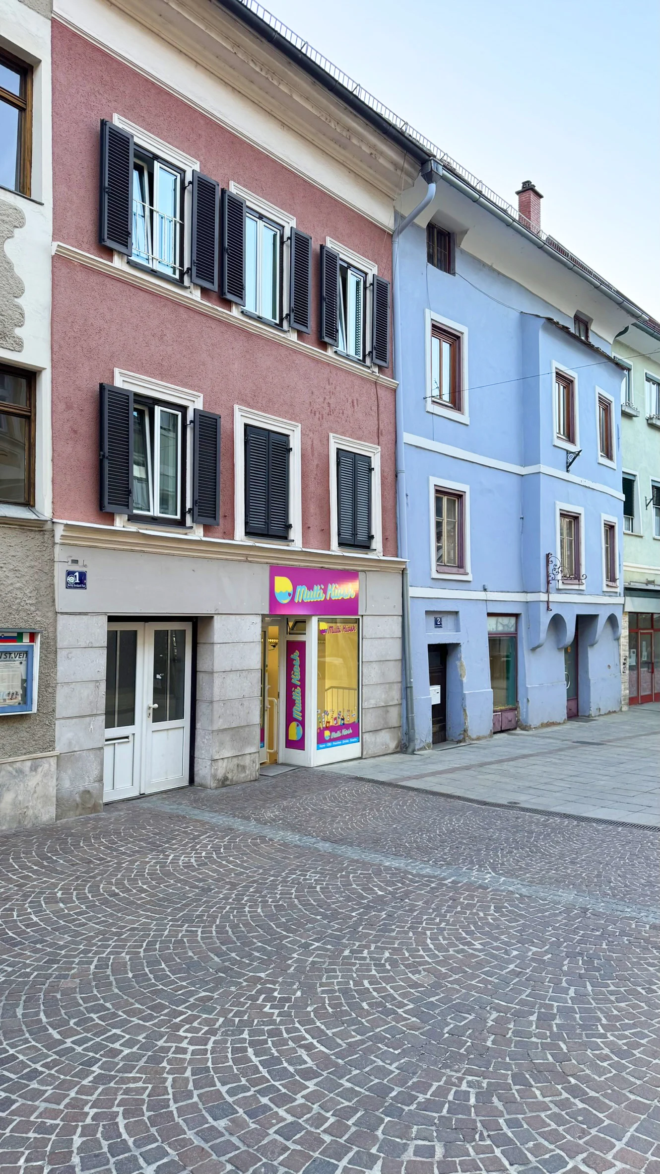 Colourful buildings line the north-western end of Herzog-Bernhard-Platz