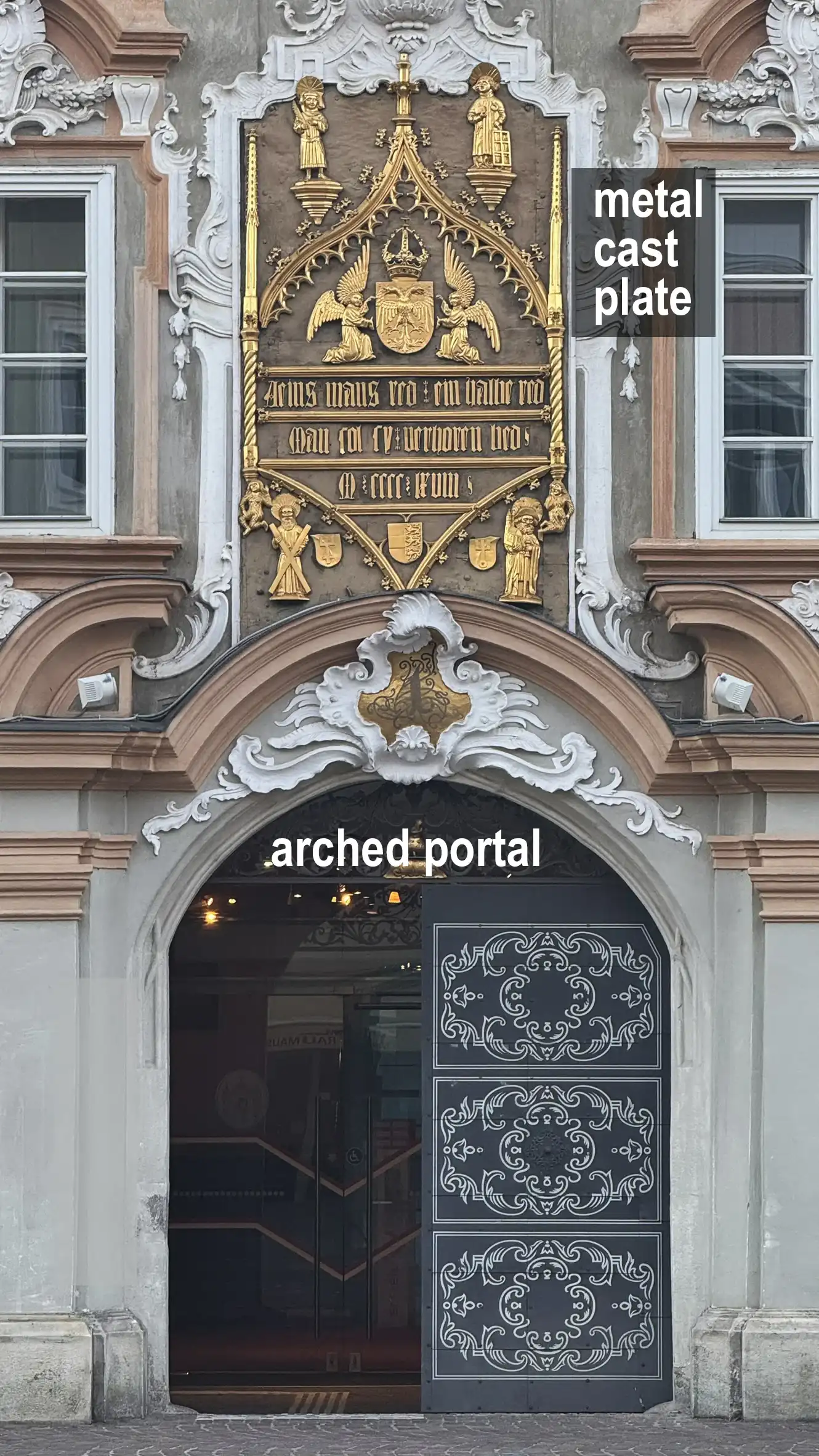 Arched portal and metal cast plate
