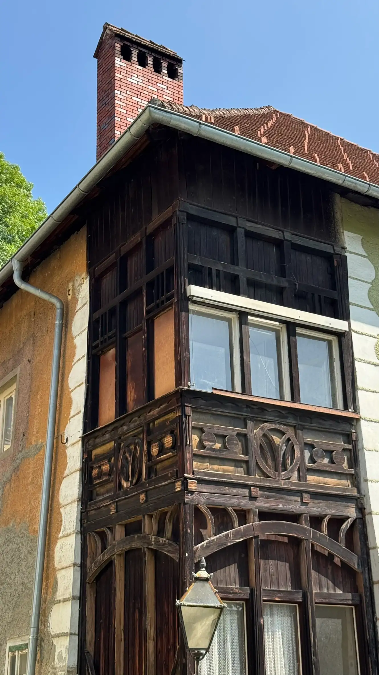 Half-timbered corner with dark framing and decorative geometric panels