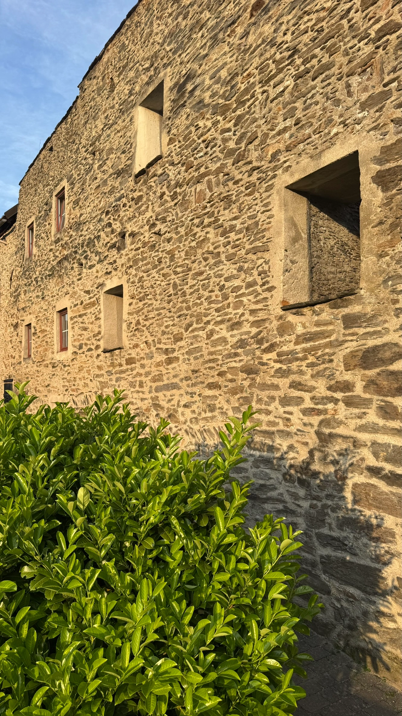 North-west town wall, now pierced with rectangular windows