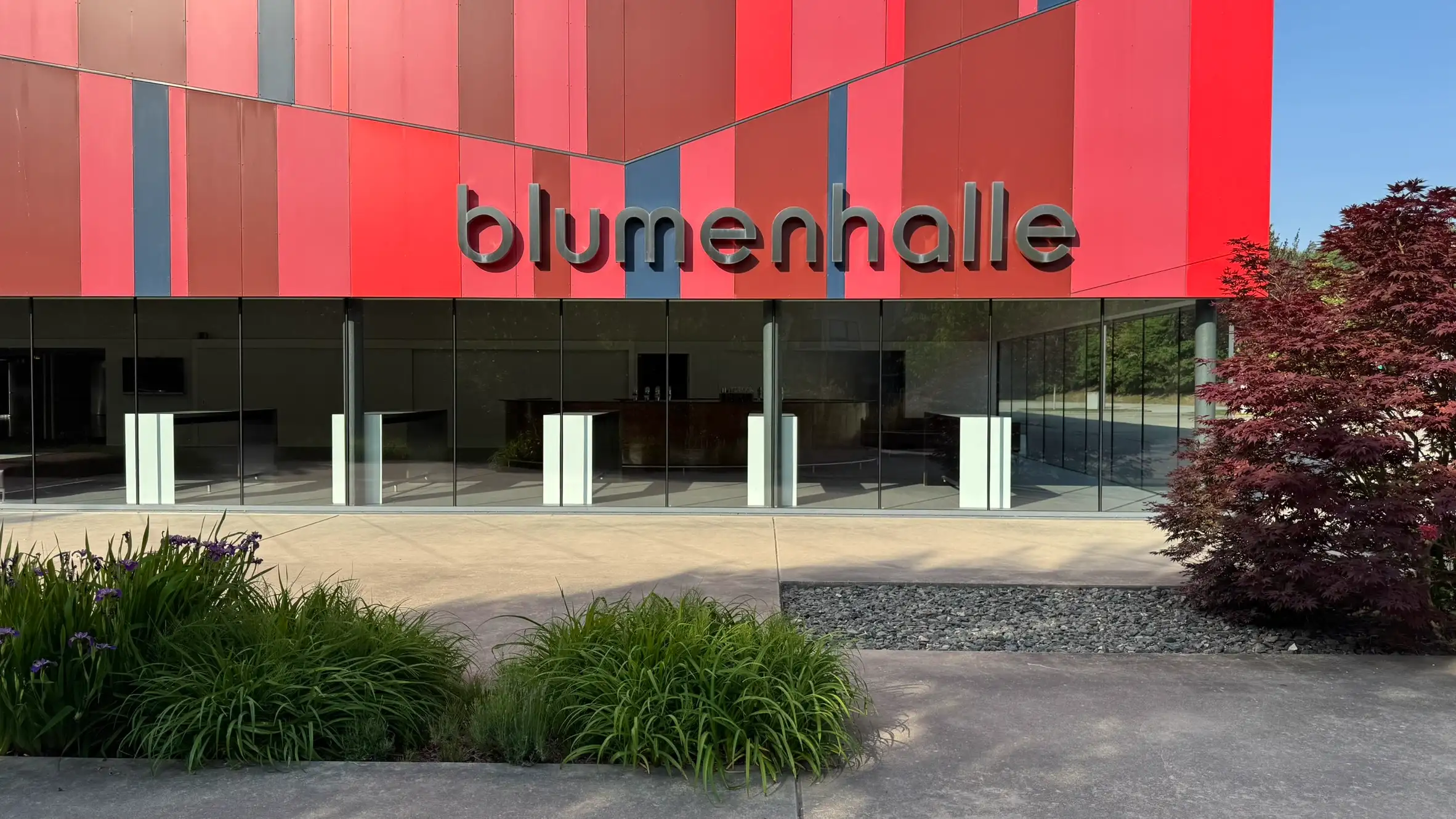 Large glass sections at ground level provide natural light.