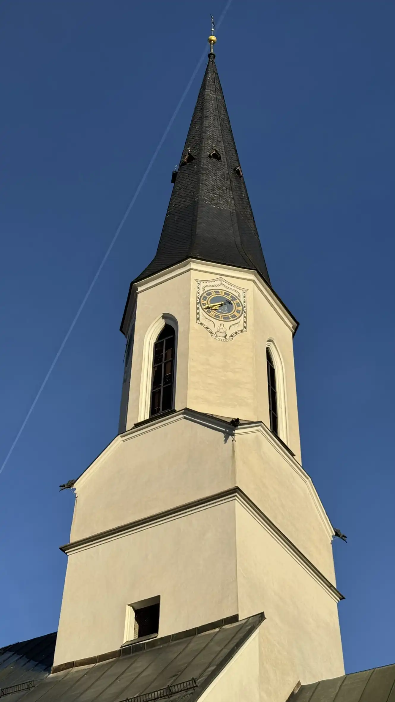 Church tower illuminated by early morning light