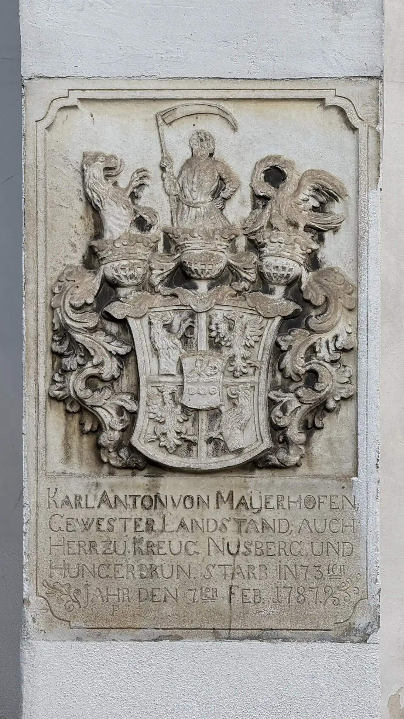 Tombstone embedded in the facade