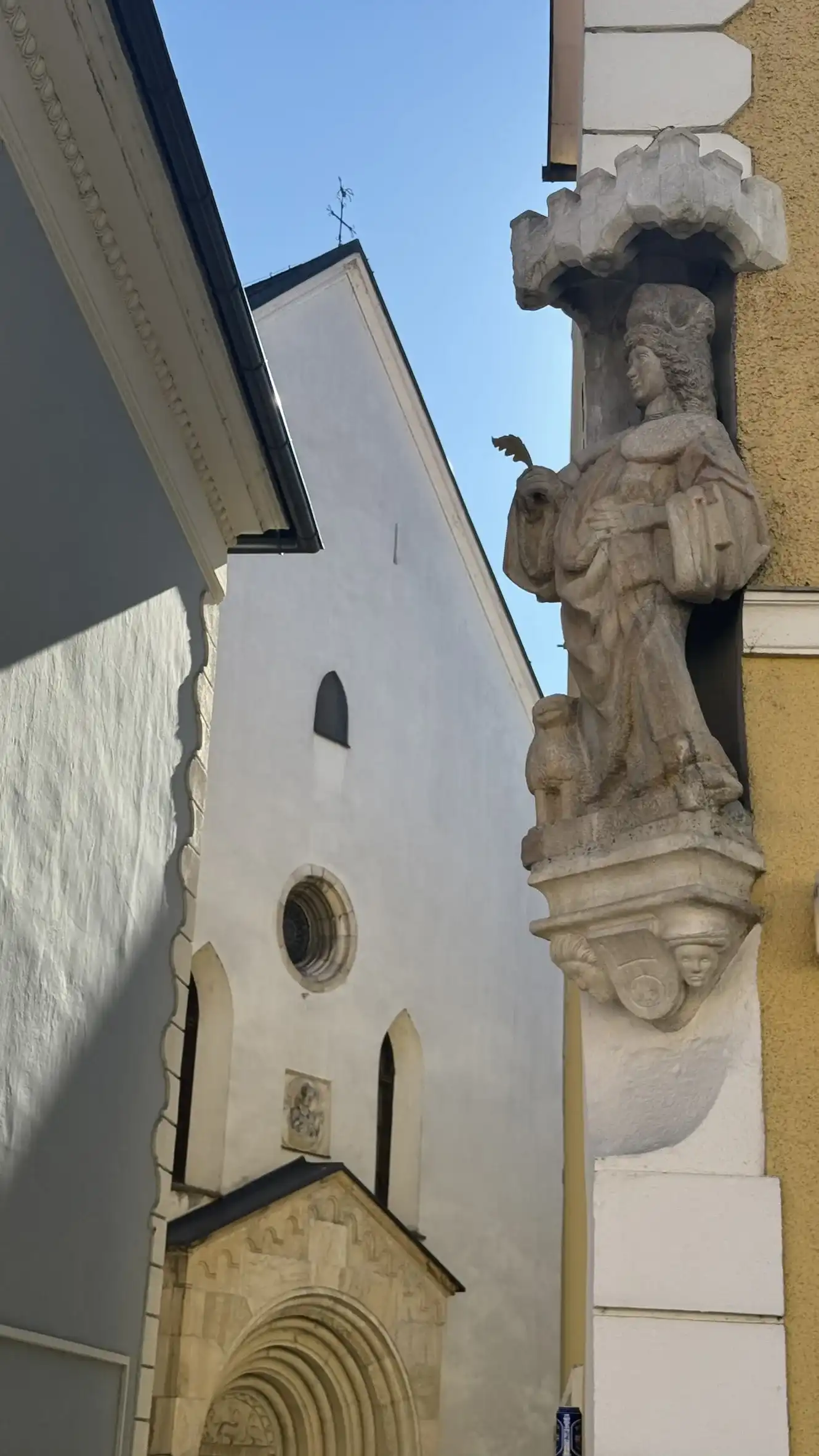 Stone statue of St Vitus holding a martyr’s palm in his right hand.