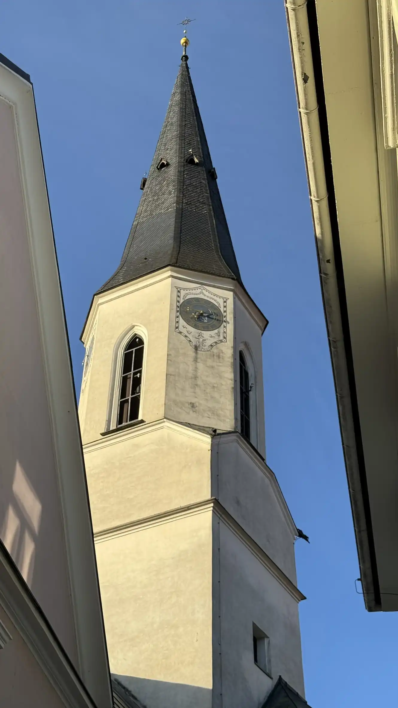 Church tower illuminated by early morning light
