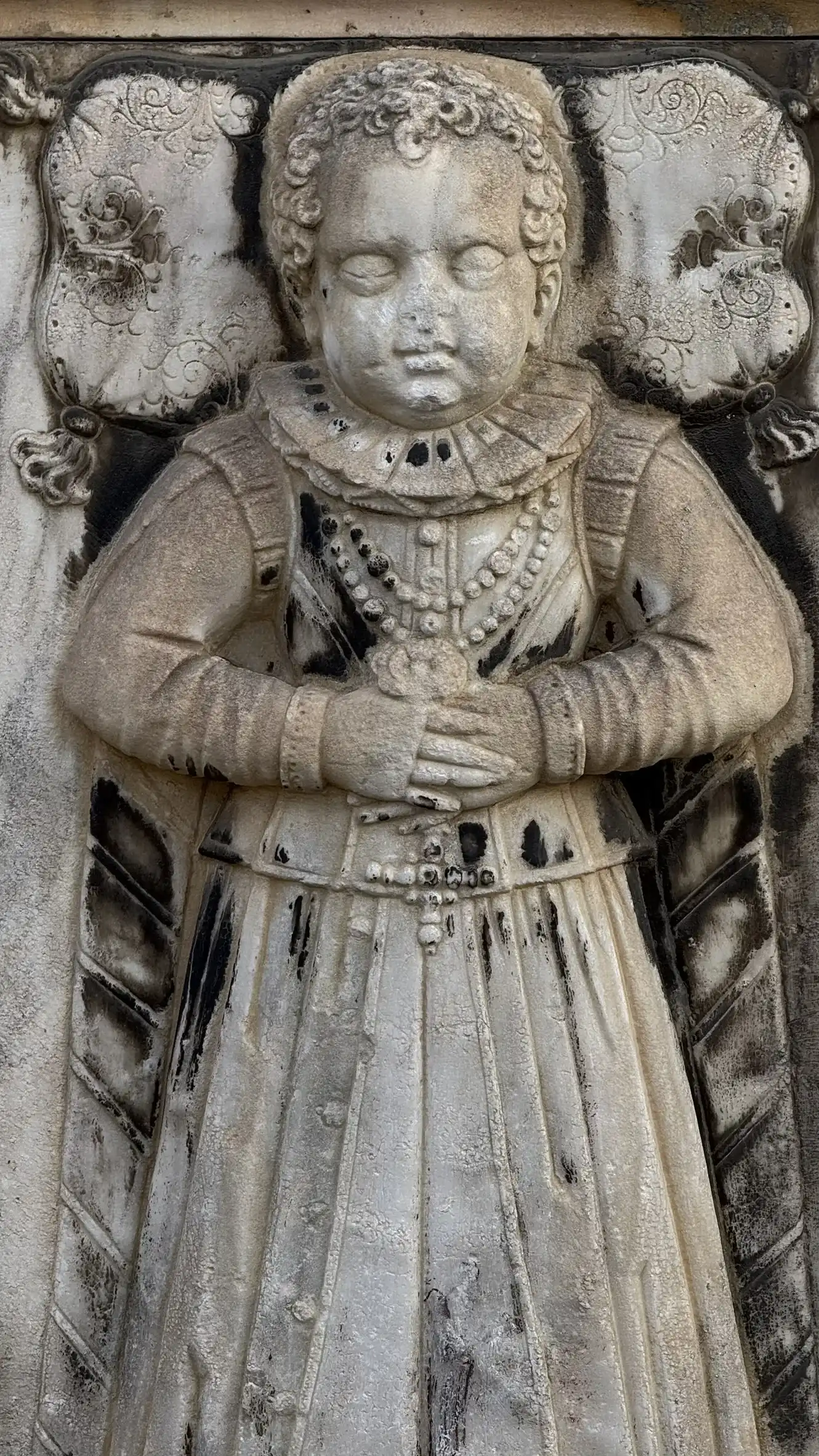 Tombstone embedded in the facade