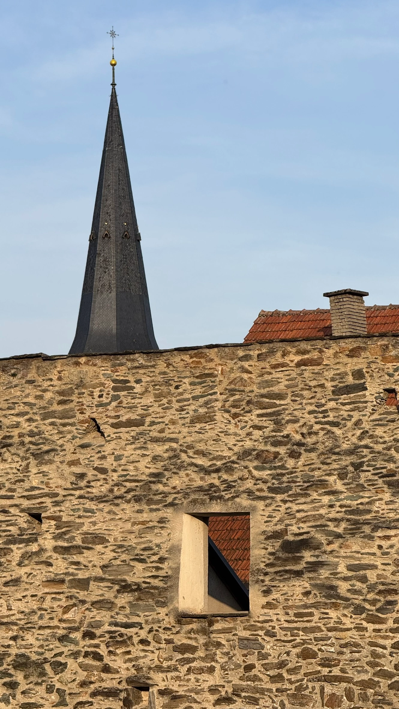 North-west town wall and parish church tower, viewed from the moat garden