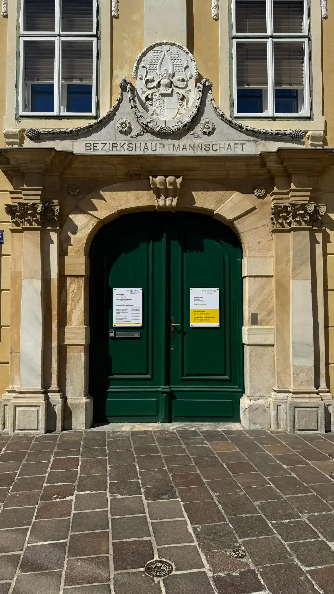 The late 18th-century segmental-arched portal is framed by pilasters.