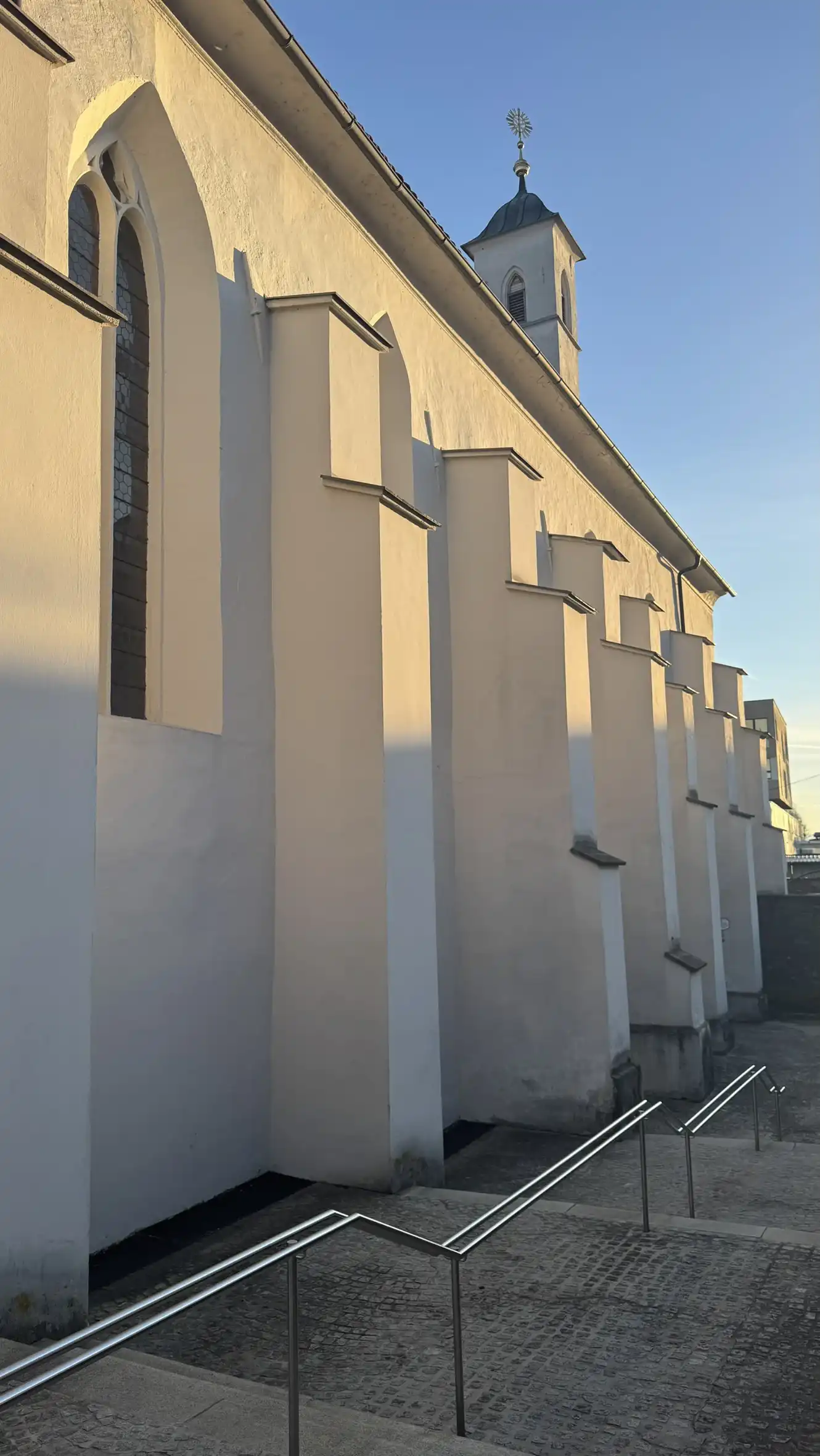 Stepped buttresses supporting the north-western wall