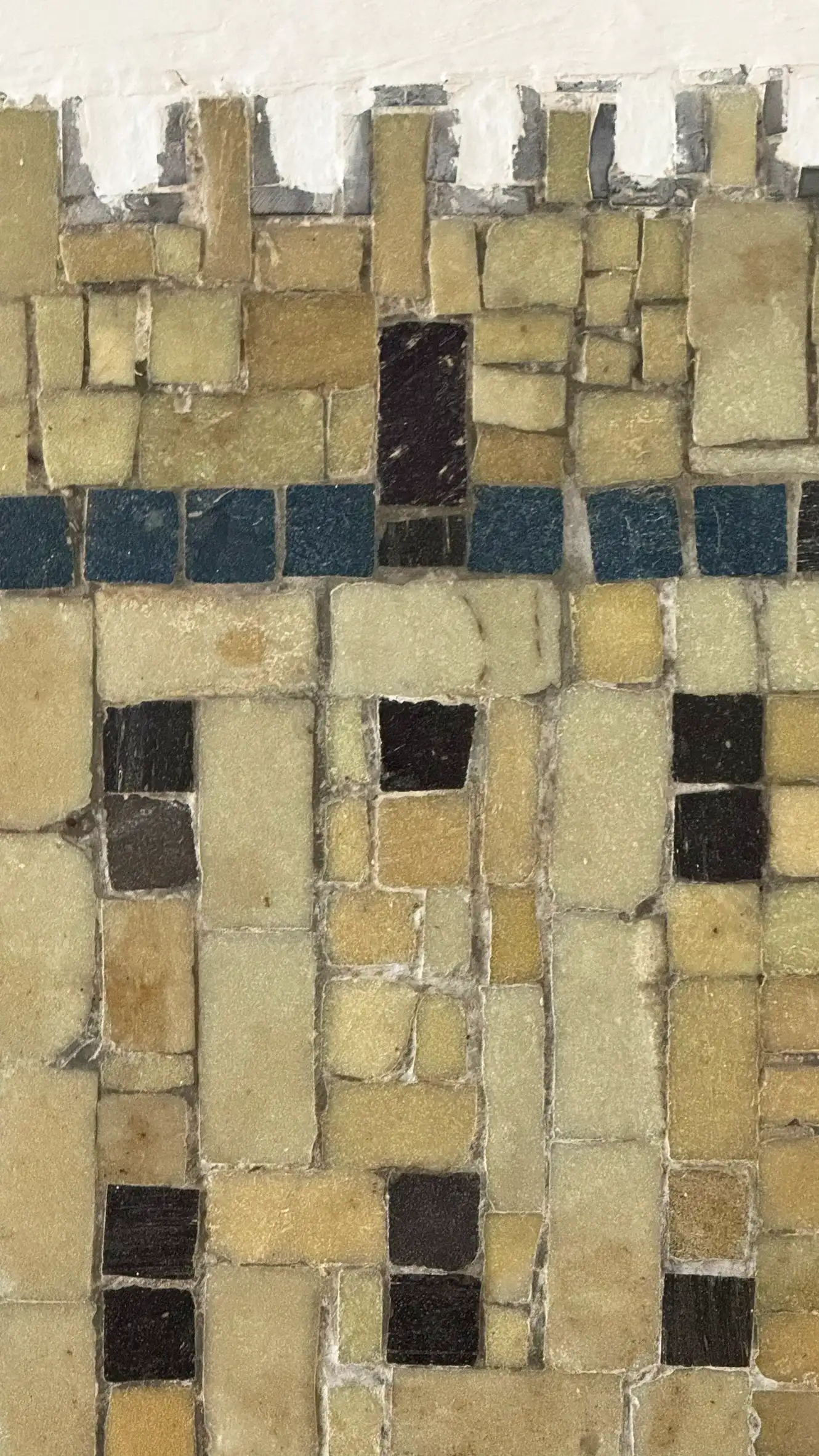 Tesserae colours: pale brown, warm yellow, teal blue, coffee brown, black
