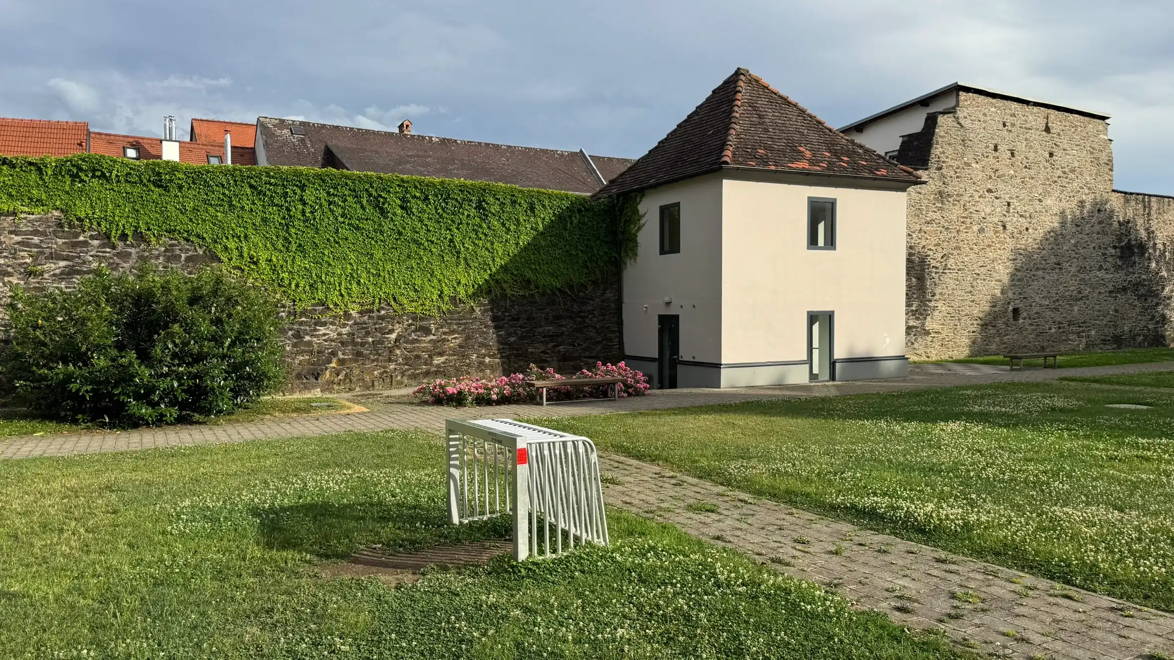 The moat garden occupies the former location of the moat, outside the north-west section of the town wall.