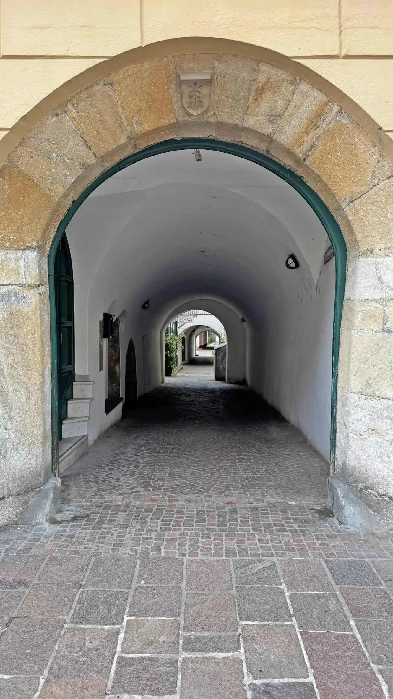 Arched entrance leading into the Sudetengasse – a covered passageway