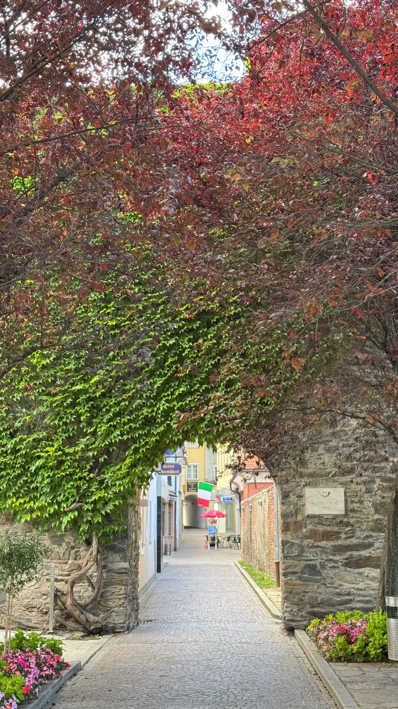 Pass through the Post-Tor and walk along the Postgasse to reach the main square.