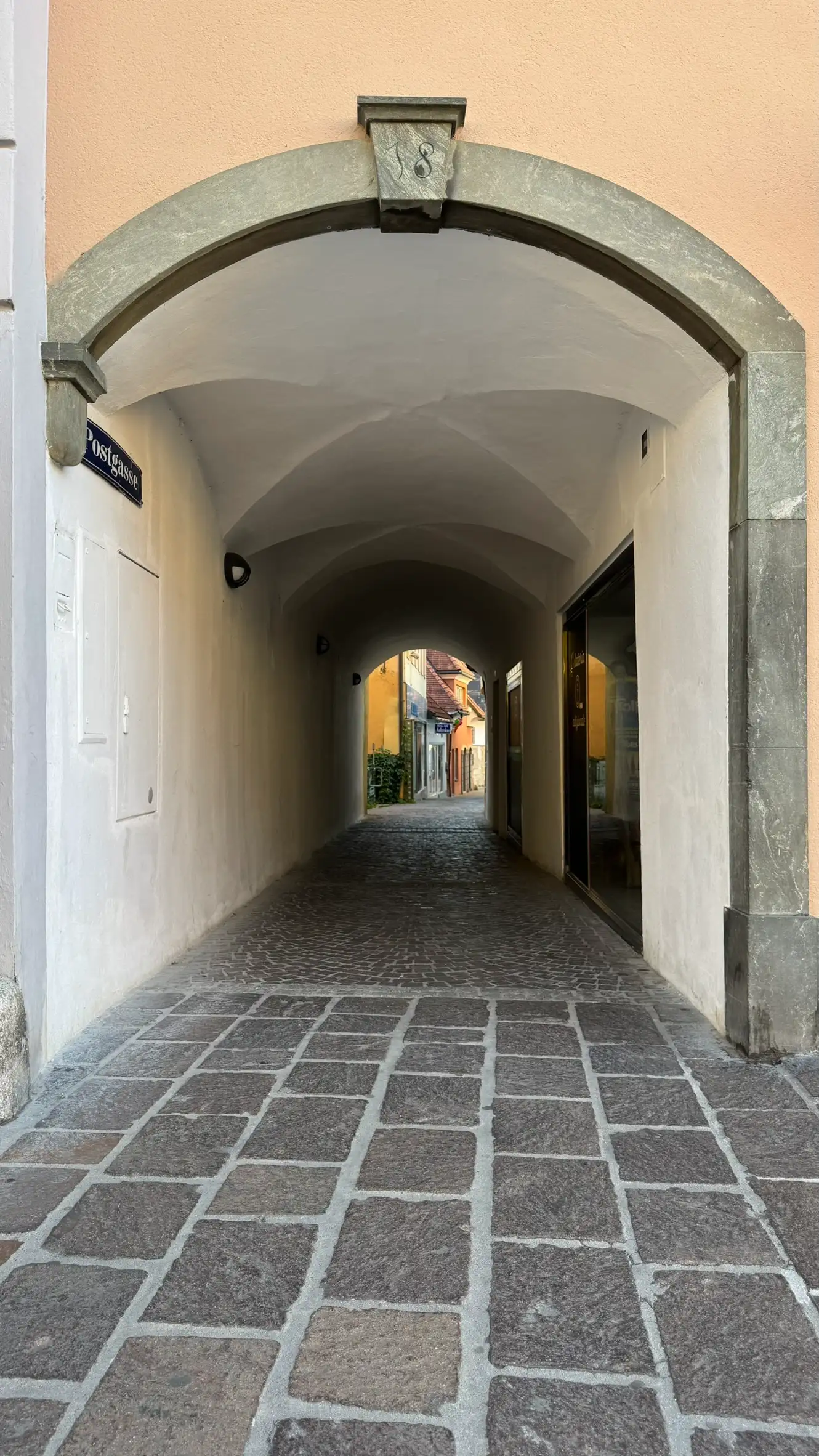 Arched entrance to Postgasse from the main square