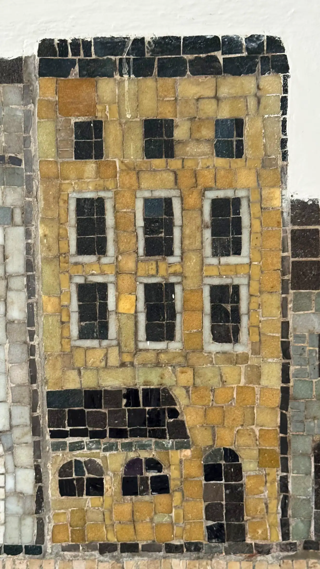 Tesserae colours: warm yellow, ochre, pearl grey, black