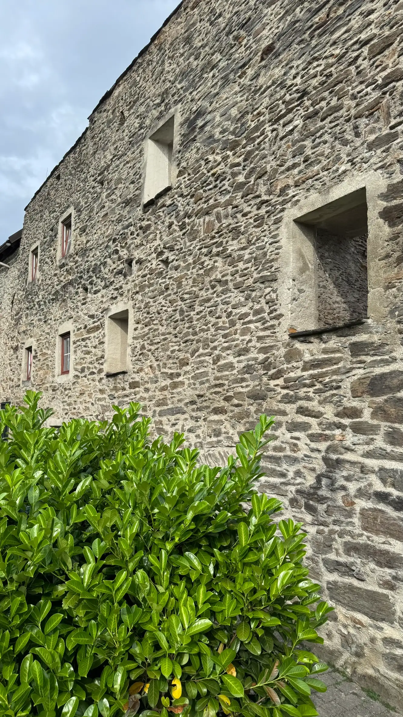 Northwest town wall, now pierced with rectangular windows