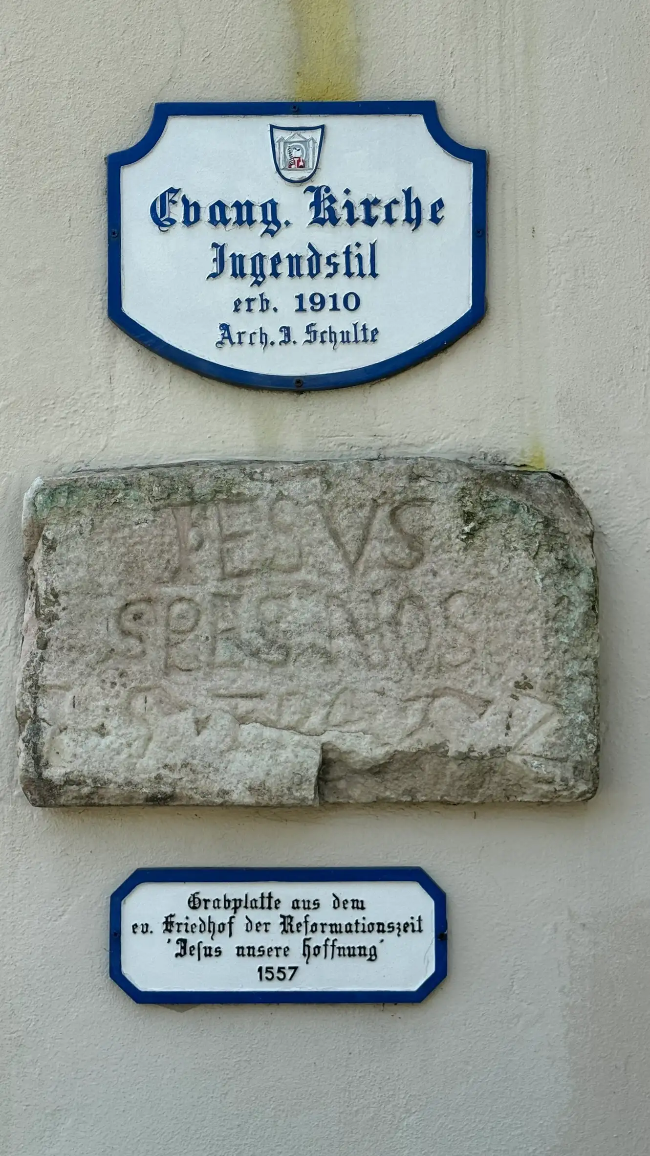 Signage text next to the entrance: Evangelical Church, Jugendstil, Built 1910, Architect Julius Schulte