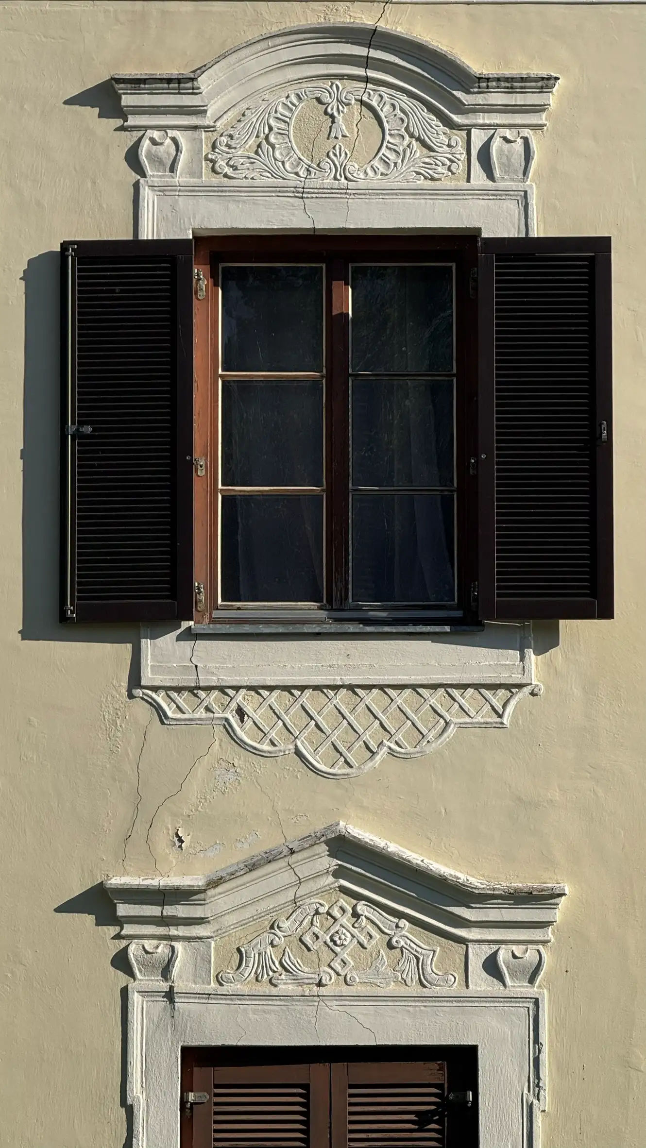 Close-up of the ornamented pediments above the windows