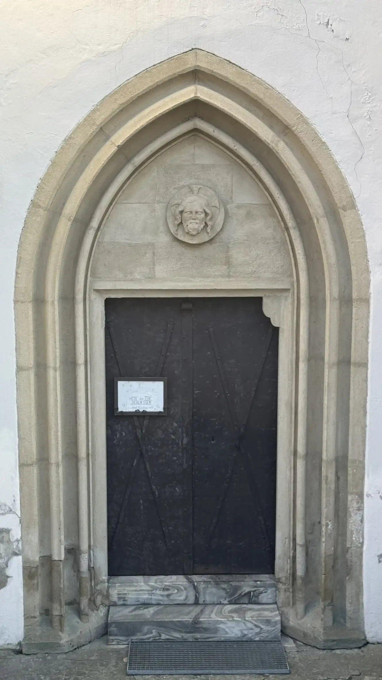 Portal, north-west facade with restored tympanum
