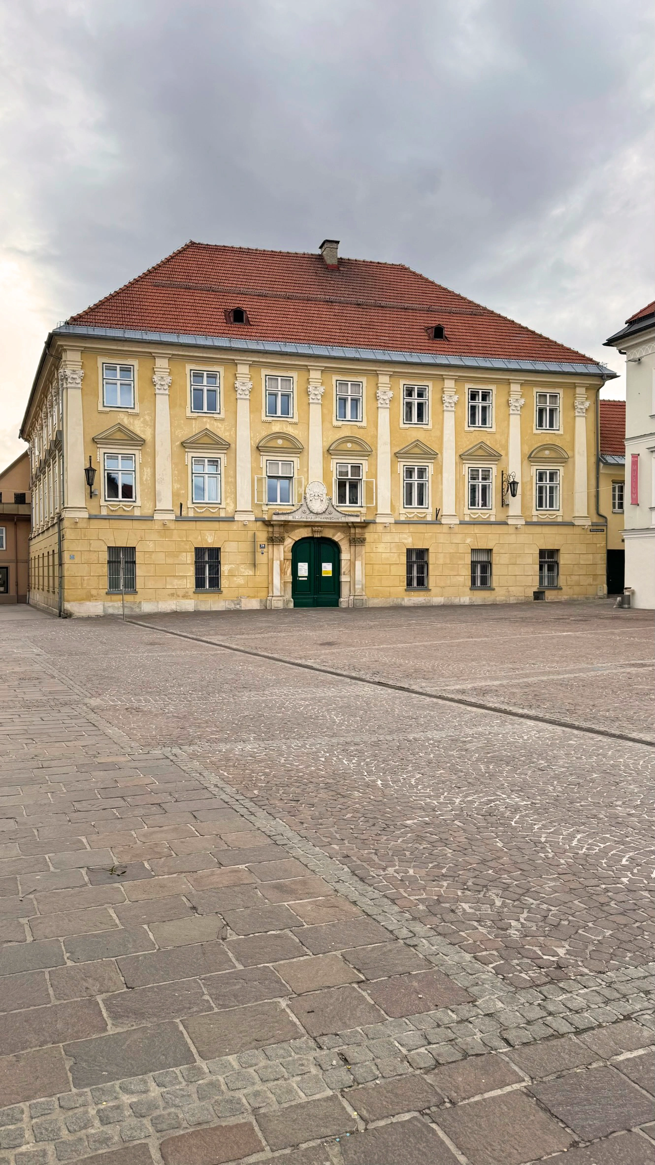 Palais Koller, at the western end of the square, is a Neoclassical building with seven window bays and three storeys.