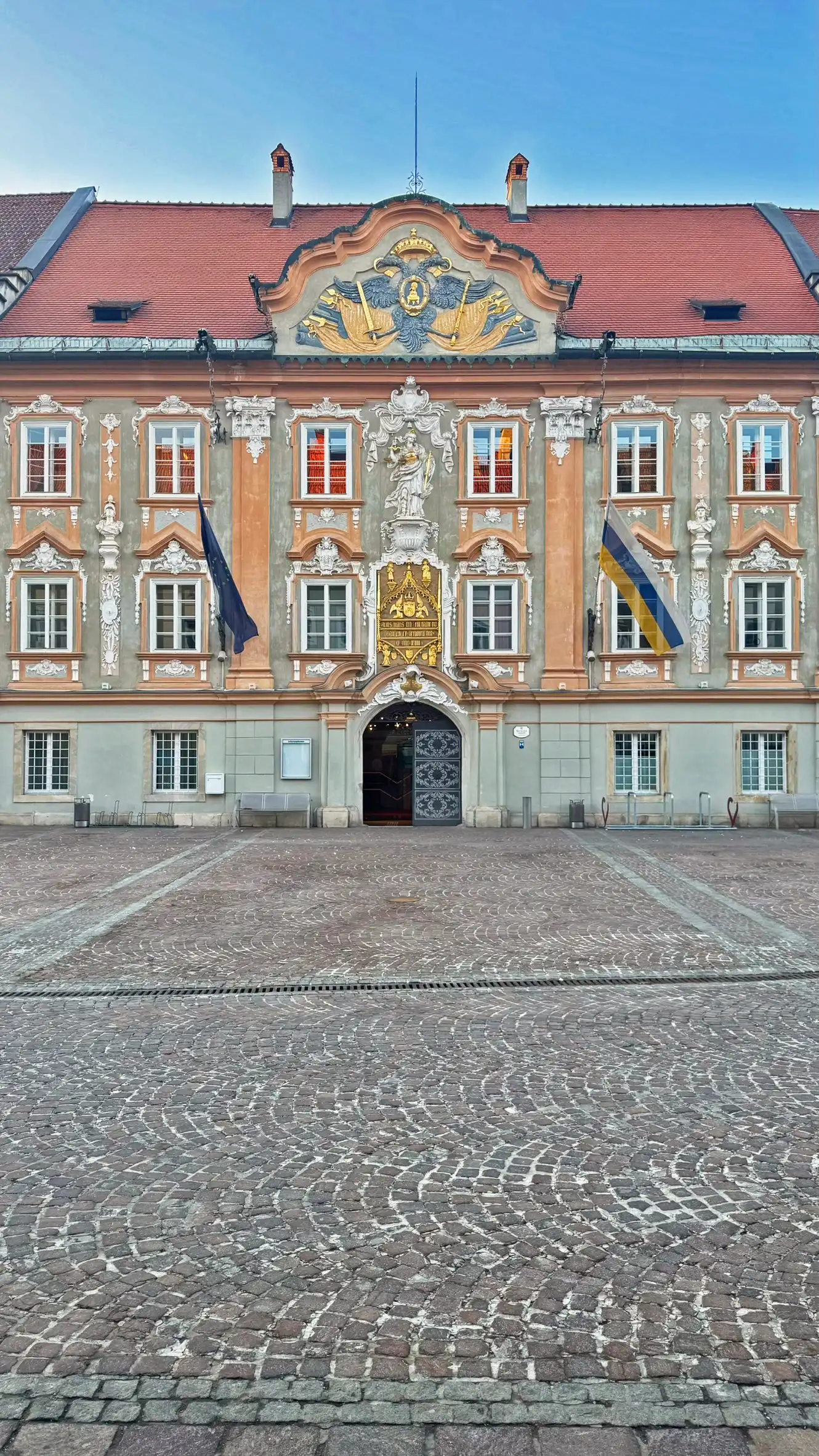The Late Baroque facade was created during the remodelling of the Gothic building.