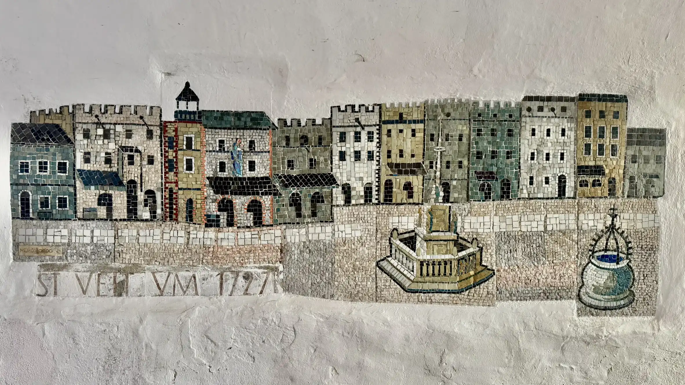 A mosaic on the wall of the arched passage, depicting St. Veit an der Glan in 1727