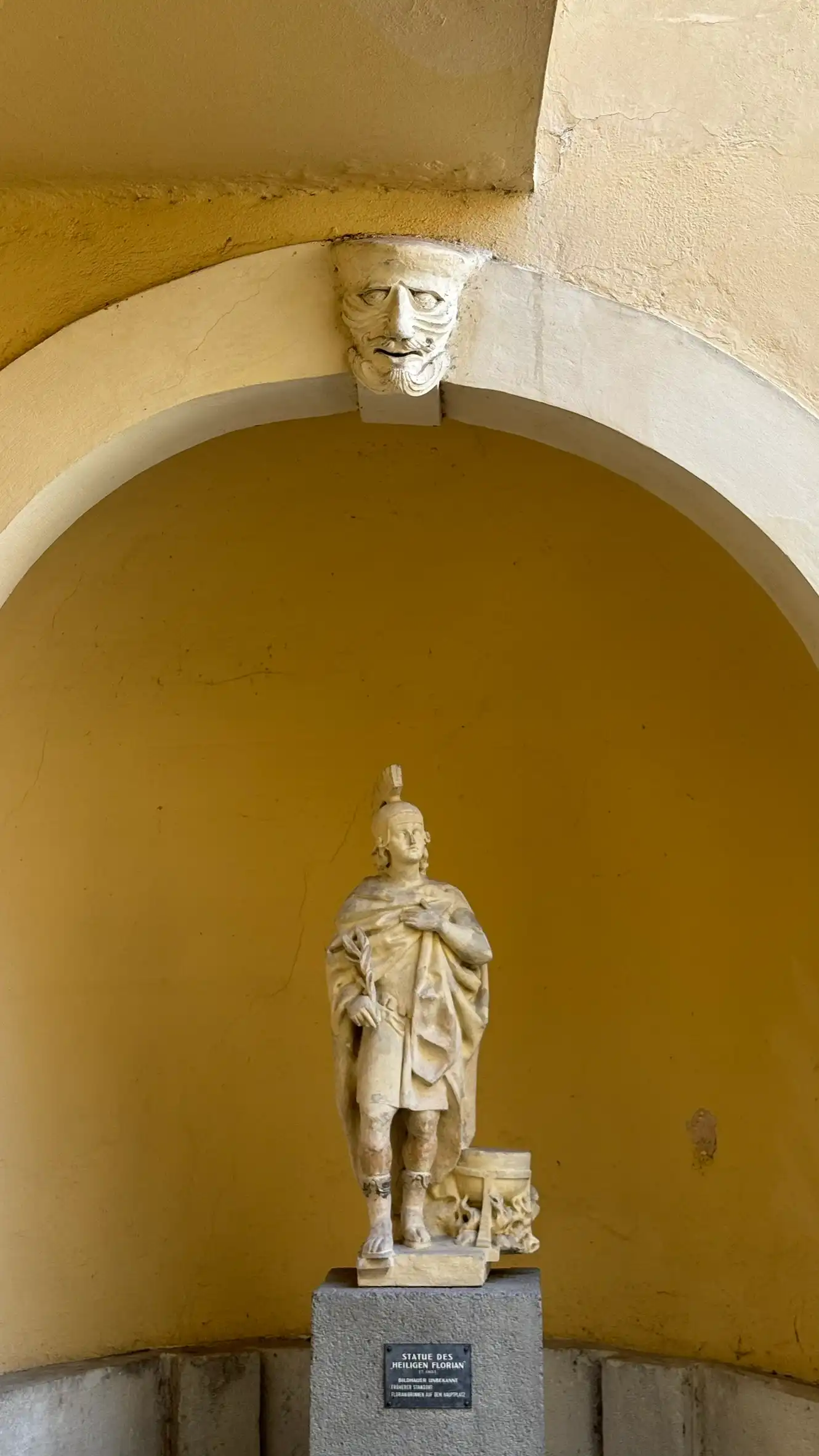 Stone statue of Saint Florian, relocated from the Floriani Fountain (main square) to the district authority building.